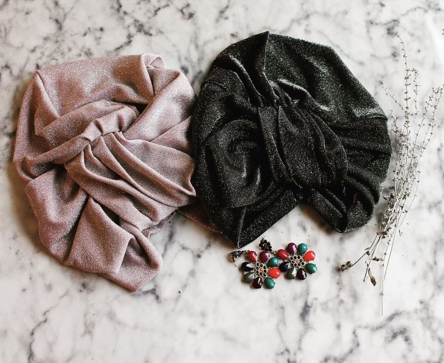 Blush and charcoal shimmer headwraps on marble